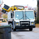 Image for article titled Here's How Garbage Truck Robot Arms Work: An Explainer